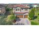 Two-story house with tile roof, double garage, and landscaped yard at 10389 Henbury St, Orlando, FL 32832