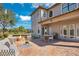 Backyard patio with fire pit, seating area, and dining table at 10389 Henbury St, Orlando, FL 32832