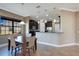 Bright breakfast nook with a table and chairs, adjacent to the kitchen at 10389 Henbury St, Orlando, FL 32832