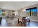 Dining area with wood table, chairs and living room access at 10389 Henbury St, Orlando, FL 32832