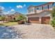 Two-story house with double garage and brick driveway at 10389 Henbury St, Orlando, FL 32832