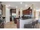 Kitchen with dark wood cabinets and granite countertops at 10389 Henbury St, Orlando, FL 32832