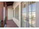 Private balcony with wood decking and French doors at 10443 Los Feliz Dr, Orlando, FL 32836