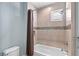 Clean bathroom with a shower/tub and tile surround at 10443 Los Feliz Dr, Orlando, FL 32836