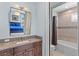 Bathroom features a shower/tub combo and granite vanity at 10443 Los Feliz Dr, Orlando, FL 32836