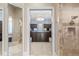 Luxurious bathroom with a large walk-in shower and views into the closet at 10443 Los Feliz Dr, Orlando, FL 32836