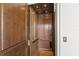 Private home elevator with wood paneling and detailed trim at 10443 Los Feliz Dr, Orlando, FL 32836