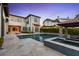 Luxury pool and spa with outdoor kitchen and seating area at 10443 Los Feliz Dr, Orlando, FL 32836