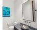 Elegant powder room with modern sink and vanity at 10443 Los Feliz Dr, Orlando, FL 32836