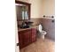 Bathroom features a double vanity and walk-in shower at 10810 Dearden Cir, Orlando, FL 32817