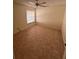 Spacious bedroom with tile flooring and ceiling fan at 10810 Dearden Cir, Orlando, FL 32817