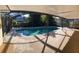 Screened-in pool area with a large, refreshing pool at 10810 Dearden Cir, Orlando, FL 32817