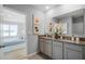 Modern bathroom with granite countertops and a view of a bedroom at 1260 Big Bass Dr, Ormond Beach, FL 32174