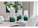 Modern dining room with elegant green glass vases at 1260 Big Bass Dr, Ormond Beach, FL 32174