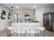 Modern kitchen island with granite countertops and seating for three at 1260 Big Bass Dr, Ormond Beach, FL 32174