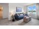 Cozy bonus room with blue sofa and lake view at 1264 Big Bass Dr, Ormond Beach, FL 32174