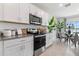 Bright kitchen with stainless steel appliances and granite countertops at 1264 Big Bass Dr, Ormond Beach, FL 32174