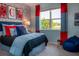 Blue and red themed bedroom with a beanbag chair at 1331 Foran Manor Rd, Haines City, FL 33844