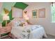 Charming bedroom with pink and green accents and floral bedding at 1331 Foran Manor Rd, Haines City, FL 33844