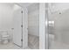 Bright bathroom featuring tile shower, toilet, and walk-in closet at 1343 Foran Manor Rd, Haines City, FL 33844