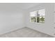 A clean and bright bedroom with neutral walls and carpet and a window offering an outside view at 1343 Foran Manor Rd, Haines City, FL 33844