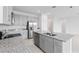 Modern kitchen with gray cabinets, granite countertops, and stainless steel appliances at 1343 Foran Manor Rd, Haines City, FL 33844