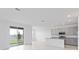 Open-concept kitchen and dining area with sliding glass doors leading to the backyard at 1343 Foran Manor Rd, Haines City, FL 33844