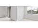 Bright living room with sliding glass door and neutral color palette at 1343 Foran Manor Rd, Haines City, FL 33844