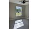 Bedroom with tile floors, neutral walls, and a large window with natural light at 1360 Jayce Ct, Geneva, FL 32732