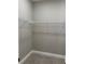 Walk-in closet with wire shelving and gray tile flooring, ready for custom organization at 1360 Jayce Ct, Geneva, FL 32732