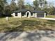 Charming single Gathering home boasting a manicured lawn, mailbox, and neutral color palette at 1360 Jayce Ct, Geneva, FL 32732