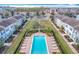 Aerial view of community pool and surrounding townhomes at 13651 Eridanus Dr, Orlando, FL 32828