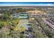 Tennis courts and basketball courts near a pond at 13651 Eridanus Dr, Orlando, FL 32828