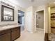 Bathroom with walk-in shower, double vanity, and modern fixtures at 13651 Eridanus Dr, Orlando, FL 32828