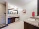 Double vanity bathroom with large mirror and tile floor at 13651 Eridanus Dr, Orlando, FL 32828