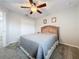 Spacious bedroom with ceiling fan and double closet at 13651 Eridanus Dr, Orlando, FL 32828