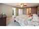 Spacious bedroom with king bed, closet, and barn door at 13651 Eridanus Dr, Orlando, FL 32828