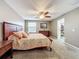 Bright bedroom with king bed, closet, and ceiling fan at 13651 Eridanus Dr, Orlando, FL 32828