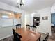 Dining room features a wood table, chairs, and kitchen view at 13651 Eridanus Dr, Orlando, FL 32828