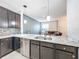 Modern kitchen with stainless steel appliances and granite countertops at 13651 Eridanus Dr, Orlando, FL 32828