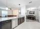 Modern kitchen with stainless steel appliances and granite countertops at 13651 Eridanus Dr, Orlando, FL 32828