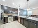 Modern kitchen with stainless steel appliances and granite countertops at 13651 Eridanus Dr, Orlando, FL 32828