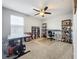 Home office with standing desk, bookshelves, and window at 13651 Eridanus Dr, Orlando, FL 32828