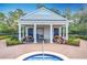 Community pool area with cabana and picnic tables at 13651 Eridanus Dr, Orlando, FL 32828