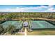 Community tennis courts with palm trees and a central pavilion at 13651 Eridanus Dr, Orlando, FL 32828