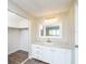 Bathroom with white vanity, gray countertop, and a shower at 1401 W Highway 50 # 68, Clermont, FL 34711