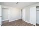 Second bedroom with ample closet space and wood-look floors at 1401 W Highway 50 # 68, Clermont, FL 34711