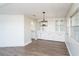 Dining room with wood floors and a stylish light fixture at 1401 W Highway 50 # 68, Clermont, FL 34711