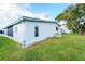 Side view of the mobile home and backyard at 1401 W Highway 50 # 68, Clermont, FL 34711