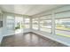 Bright sunroom with wood-look floors and multiple windows at 1401 W Highway 50 # 68, Clermont, FL 34711